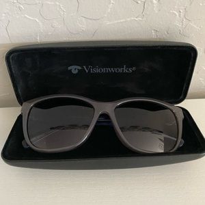gray and blue sunglasses with case